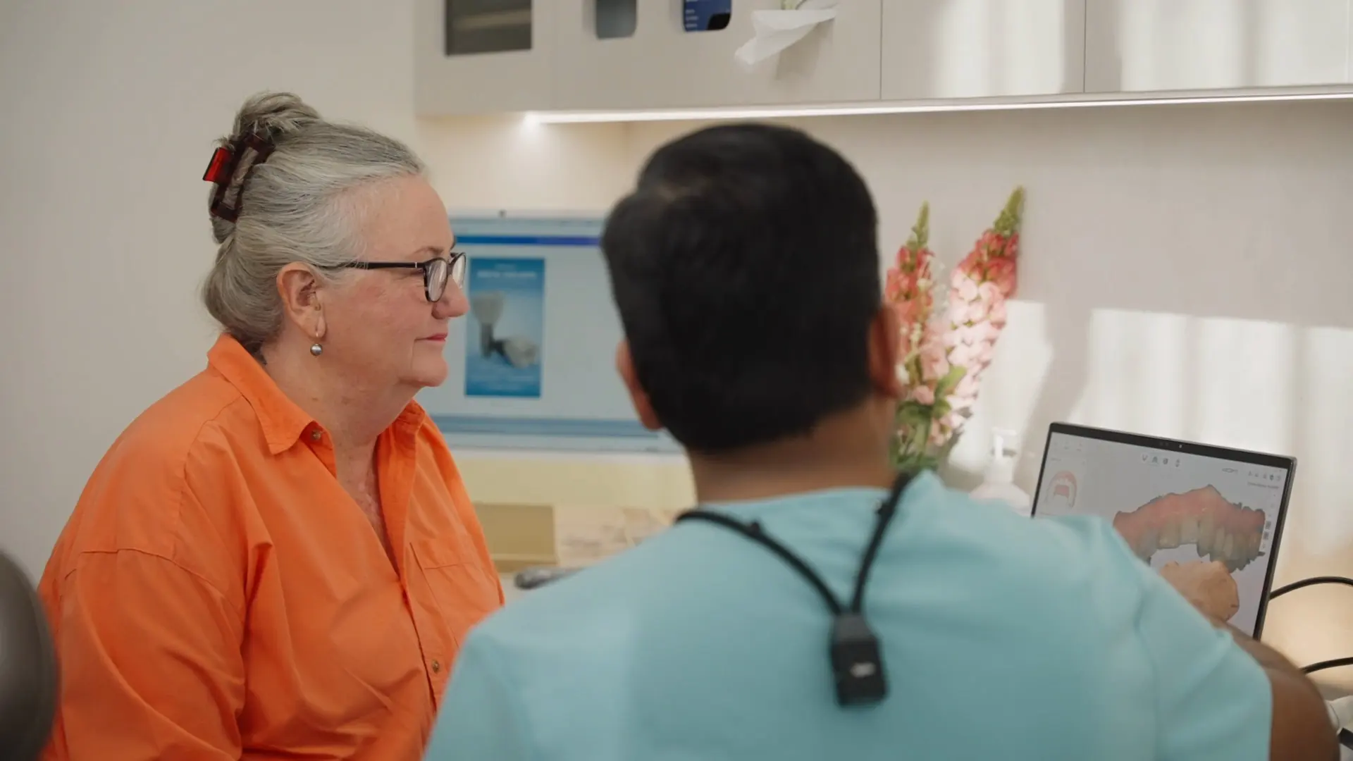 A patient smiling during a consultation at Dental Embassy