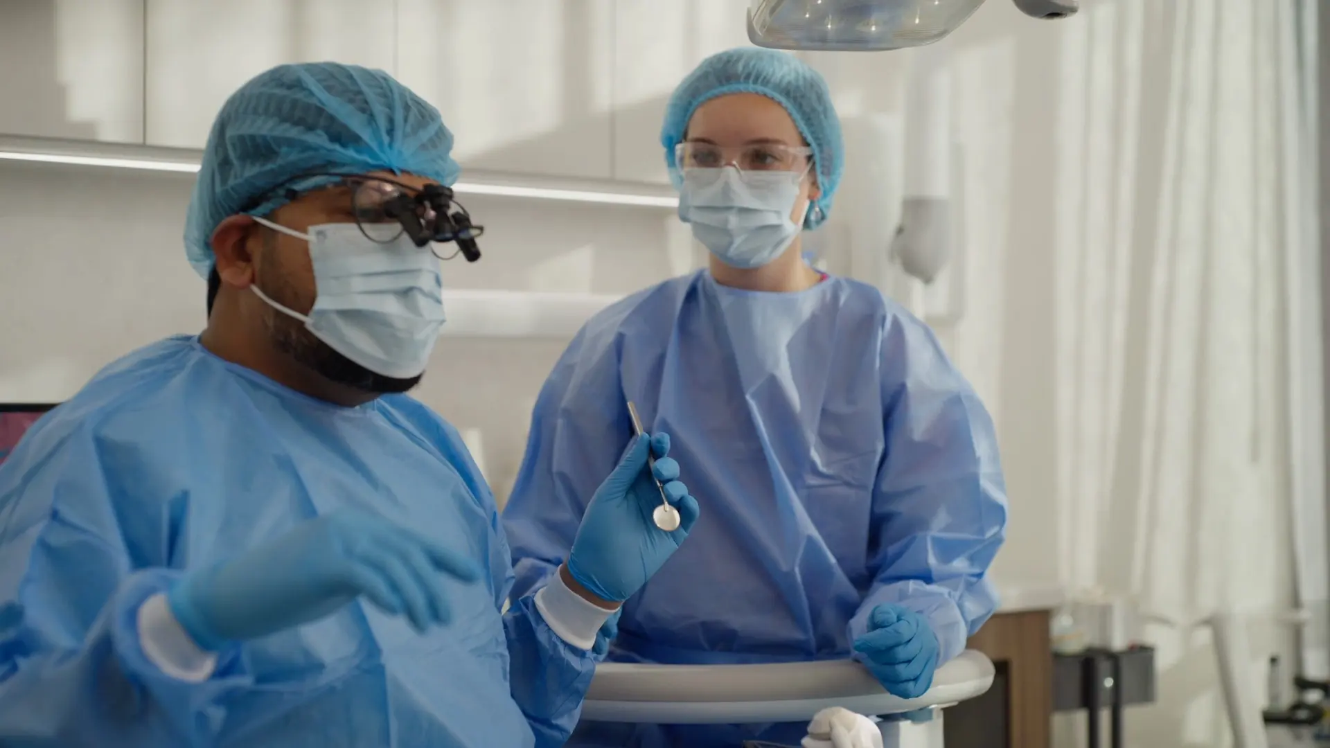 The surgical team in gowns and masks ready for a sedation appointment
